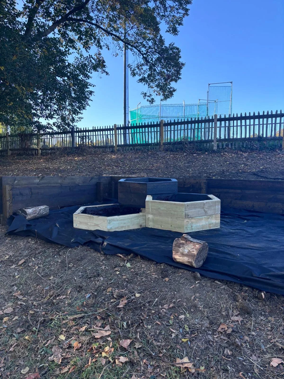 Installed hexagonal raised timber planters and retaining works at the Adventure Playground
